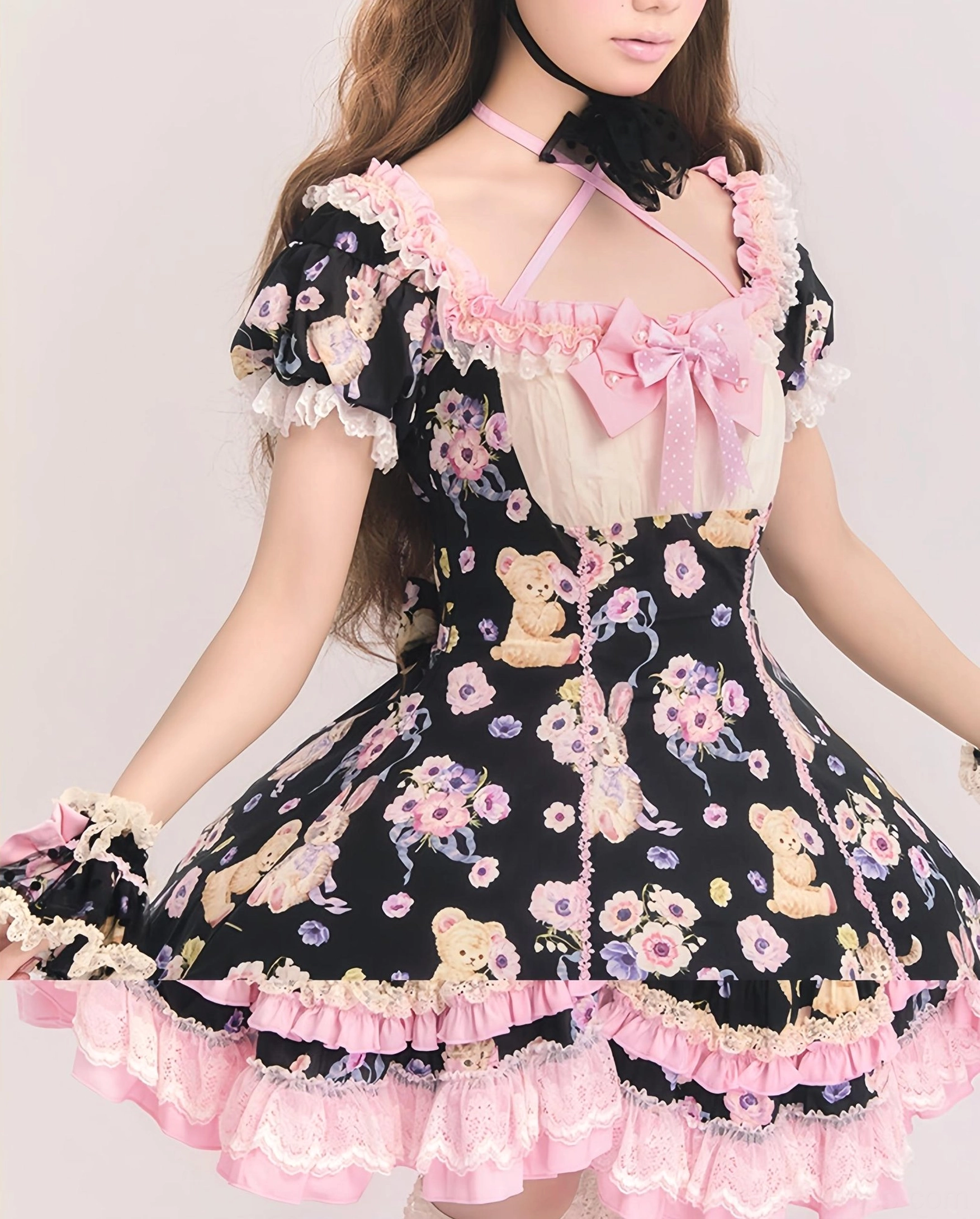 Half-body front close-up of halter neck strap with black bow, square lace neckline, puff short sleeves detail, black sweet lolita OP dress, studio light background