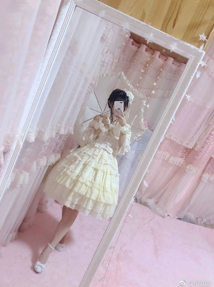 Pastel Sweet Lolita OP dress in pink, yellow, and blue color variants with tiered ruffle design and romantic vintage aesthetic