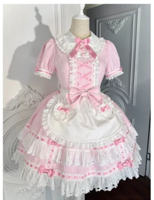 Sweet pink and white Lolita short-sleeve OP dress with Peter Pan collar featuring crisscross ribbon front and multi-layered ruffled lace skirt, modeled on dress form against retro carved door background