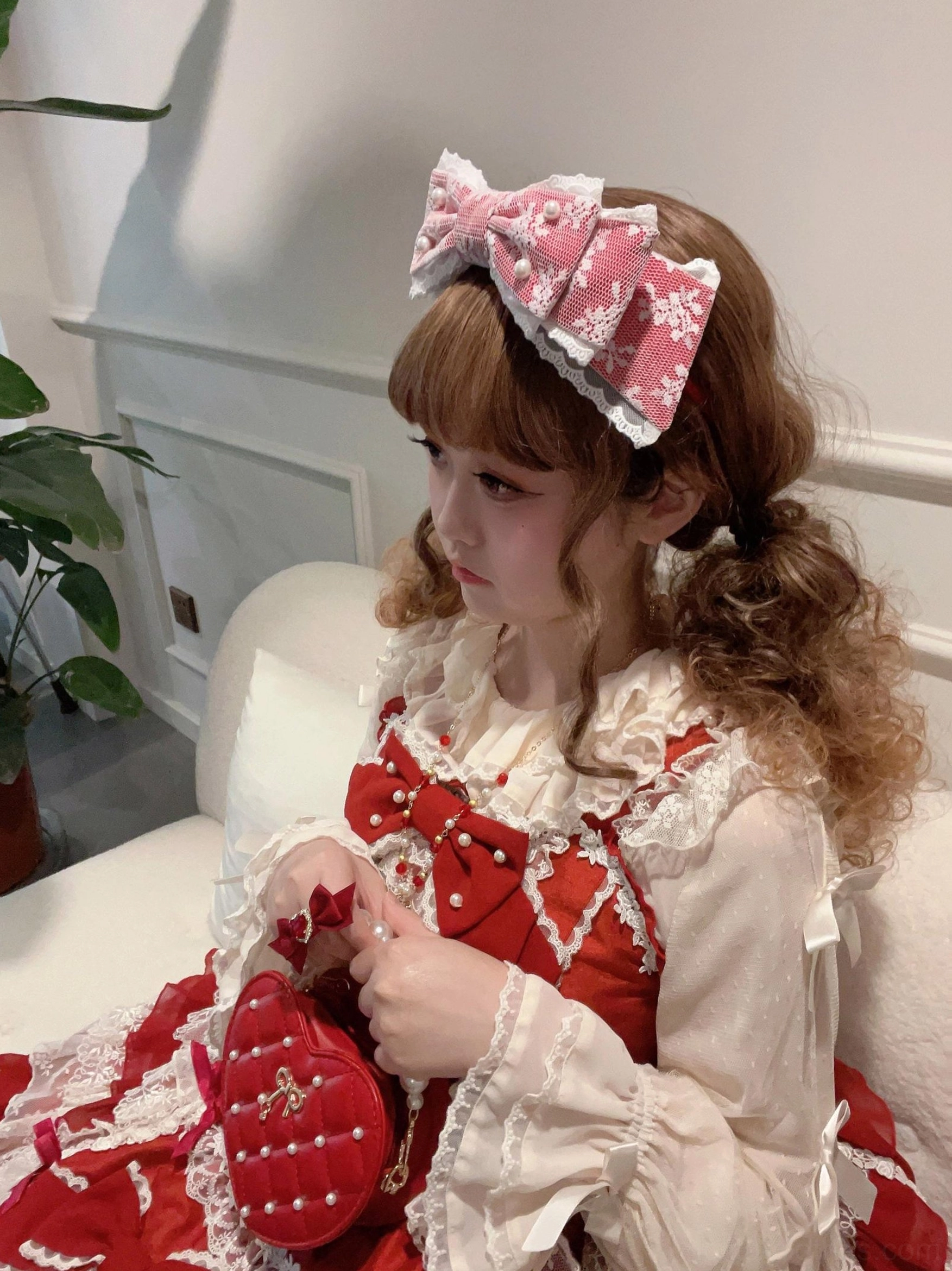 Sweet lolita pearl bow KC headband side profile view showing dimensional bow design and lace construction