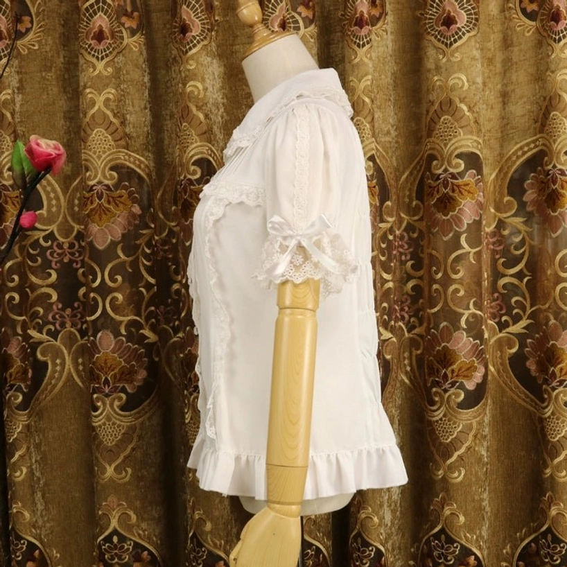 Milk white short-sleeve sweet lolita blouse with Peter Pan collar, left side full view displaying ruffled lace sleeves and blouse construction