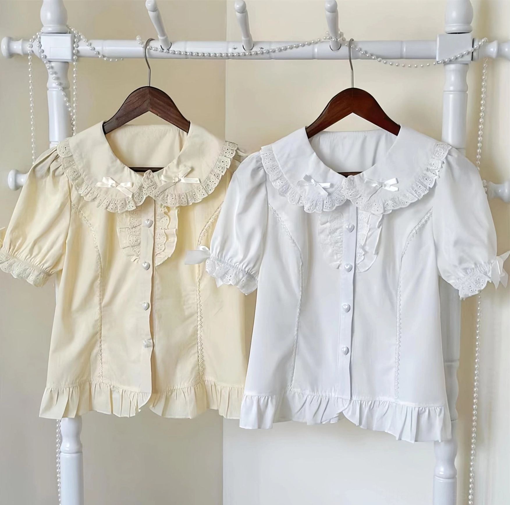 Sweet lolita peter pan collar blouse front view hanging display white apricot color options lace trimmed collar ruffled hem heart button closure