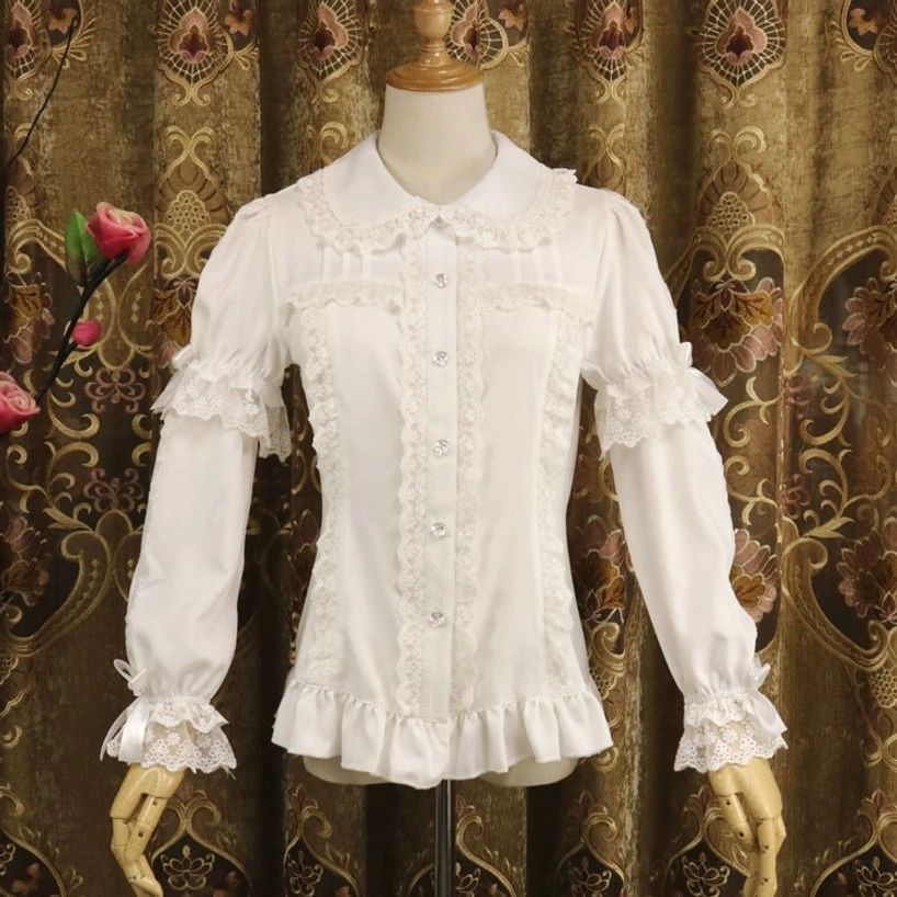 Milk white long-sleeve sweet lolita blouse front three-quarter left view displaying Peter Pan collar, button placket, ruffled lace cuffs, fitted silhouette