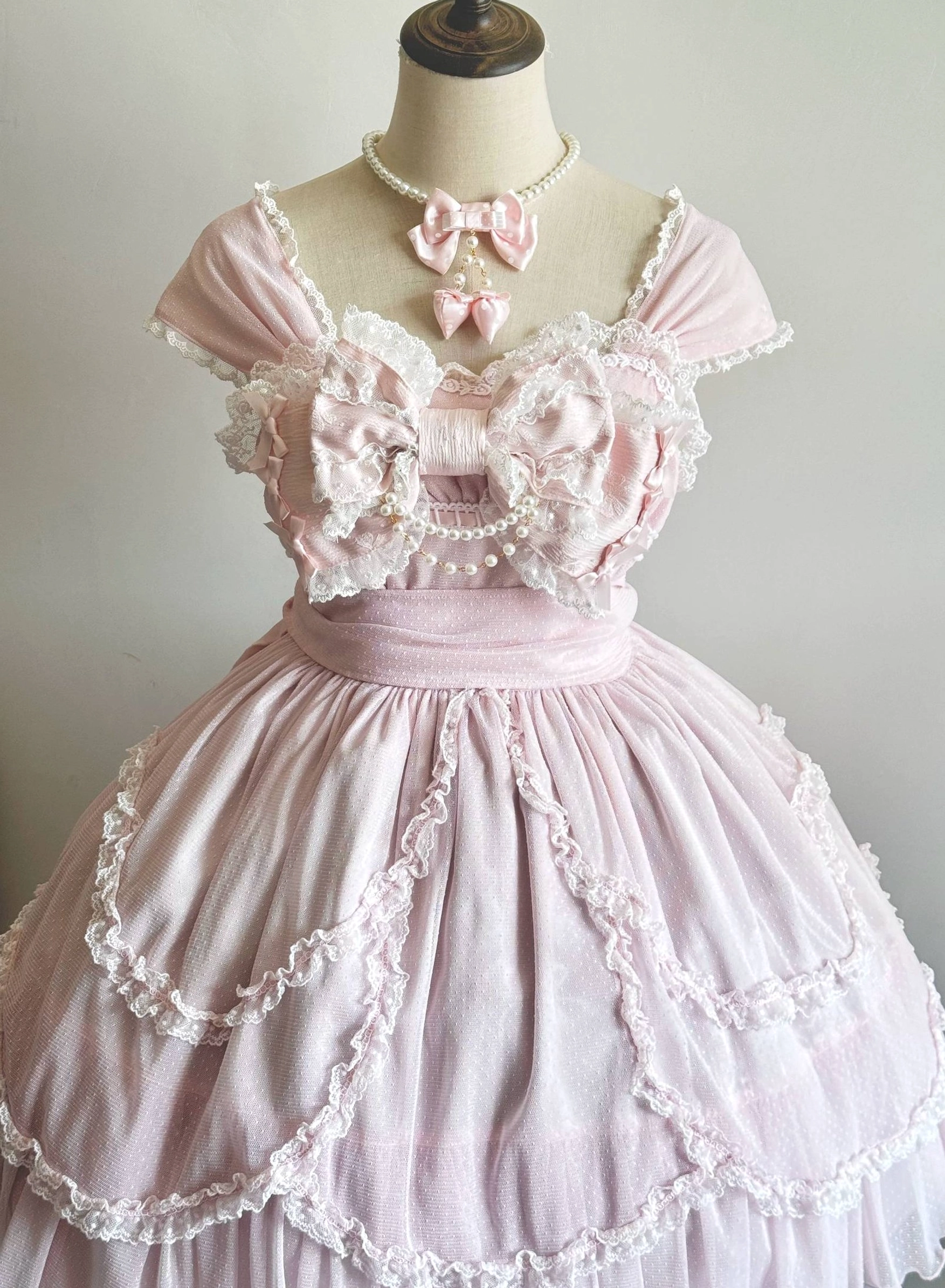 Sweet lolita pink bow pearl necklace worn by BJD doll in frilly pink lolita dress matching coordinate