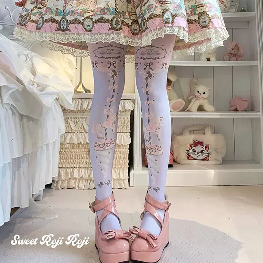 Sweet Lolita pink carousel print velvet pantyhose detail view on model with sweet Lolita ensemble bedroom setting pink bow platform shoes