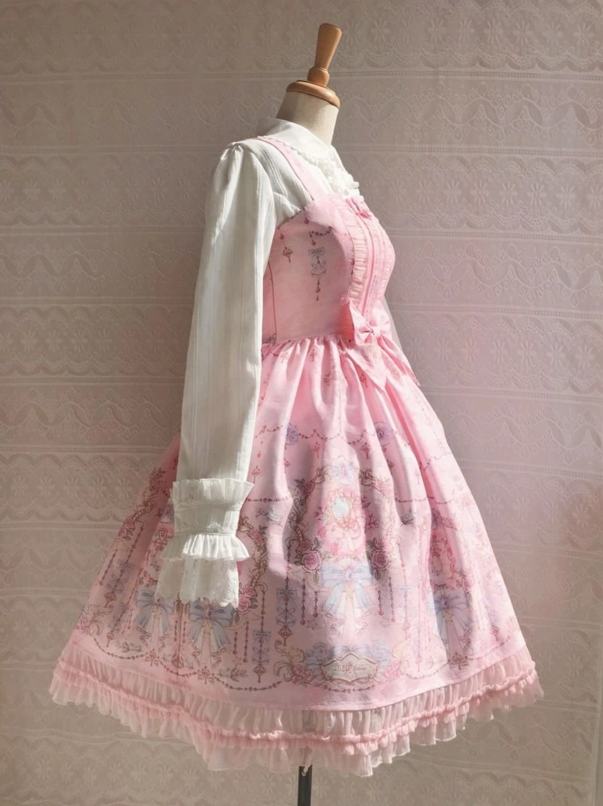 Side front view of sweet lolita JSK dress with pink base vintage floral print attached ruffled sleeves large front waist decorative bow frilled hem