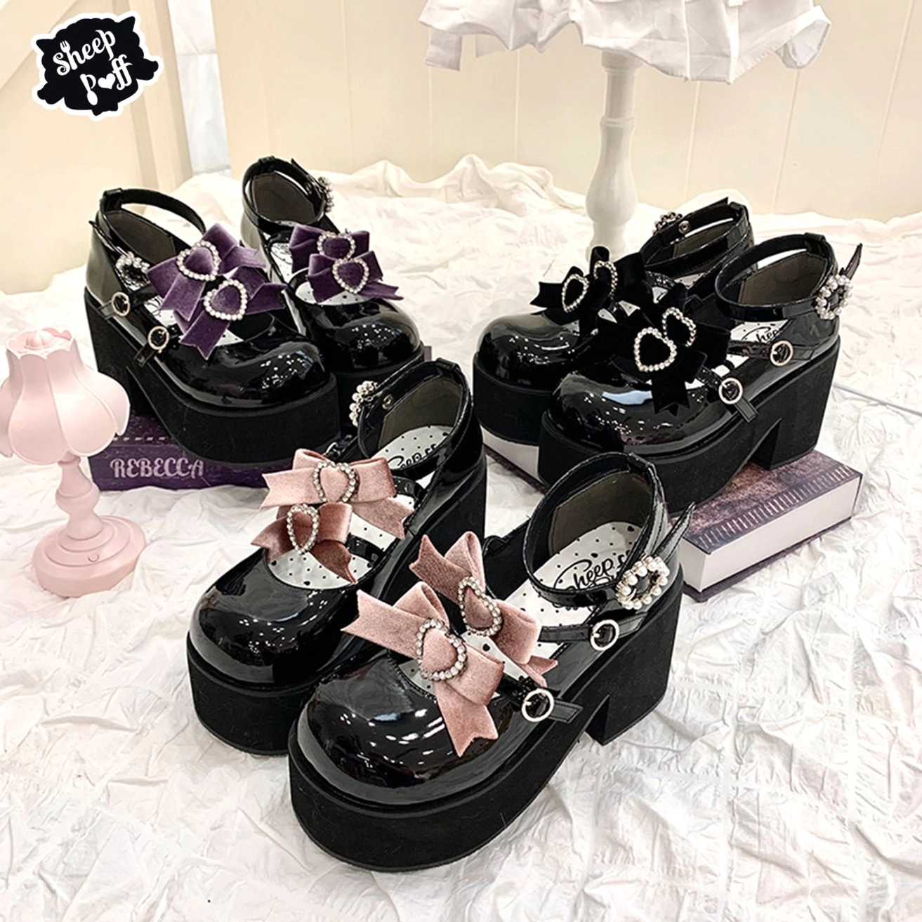 Sweet lolita punk platform heel shoes flat lay display with patent leather finish and heart-shaped metal buckles on bedroom tabletop