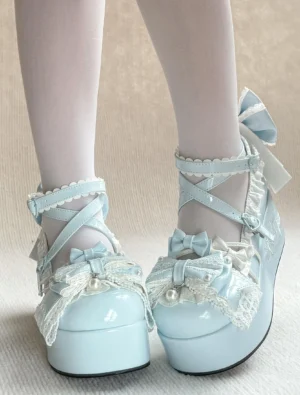 Baby blue Sweet Lolita platform heels on-foot overhead shot featuring crisscross ankle strap buckle, delicate lace frills, decorative bowknot, and light blue glossy patent leather finish
