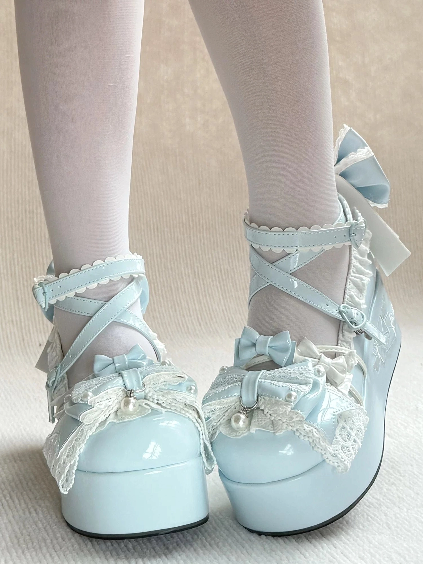 Sweet Lolita high platform shoes overhead detail view showcasing detachable satin bowknot at heel, lace trim construction, ruffled cuff design, and overall silhouette from above