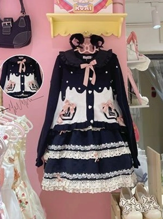 Sweet Lolita puff sleeve cardigan coat black white cake-style print bow decorations ruffled tiered hem flat display with detail close-up