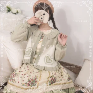 Sweet Lolita puff sleeve cardigan coat matcha green off-white color scheme with heart-shaped appliqué doll collar and ruffled cuffs half-body indoor display