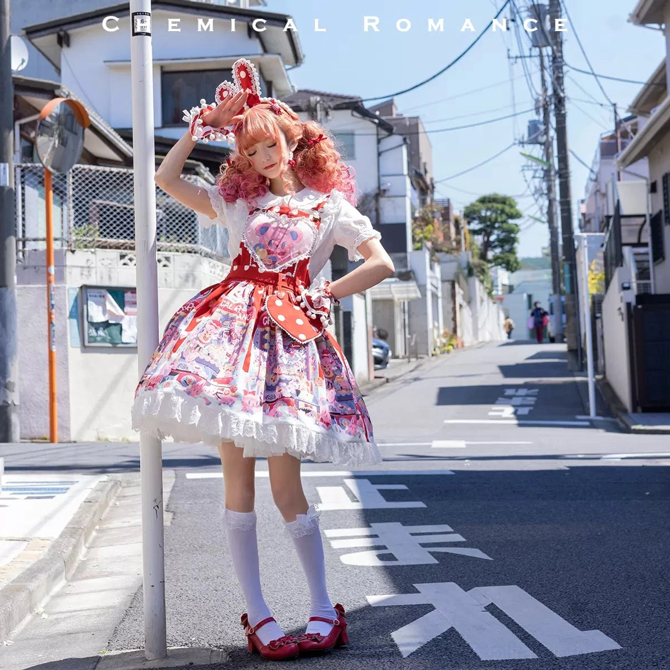 Sweet lolita printed salopette dress with bear heart design full body front view outdoor street scene pink curly hair model
