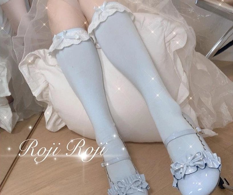 Sweet lolita lace-trimmed socks fabric close-up detail showing combed cotton spandex blend quality ruffled lace cuff and bow accents premium material texture