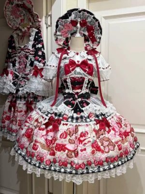 Sweet lolita strawberry bear print tiered lace JSK dress front view with red bow and layered ruffles on dress form