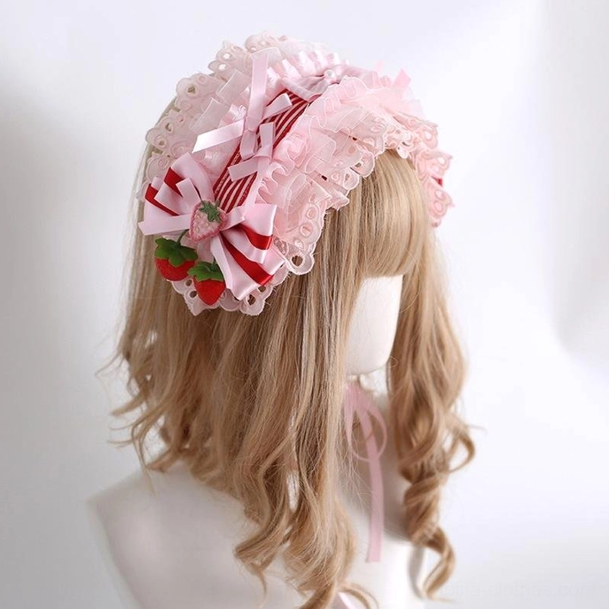 Sweet lolita pink striped strawberry headband with ruffled lace trim and bow decoration worn on mannequin left three-quarter view