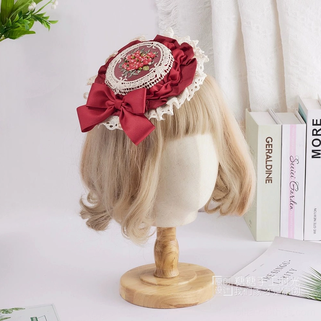 Deep burgundy Sweet Lolita top hat with coordinating wine-colored satin bow, red berry floral embroidery medallion, and refined white cotton lace trim