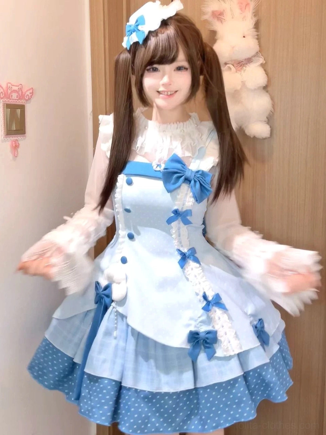 Sweet Lolita trailing bow and choker accessories detail showing oversized blue polka dot bow, neck choker piece, color matching coordination with main JSK dress