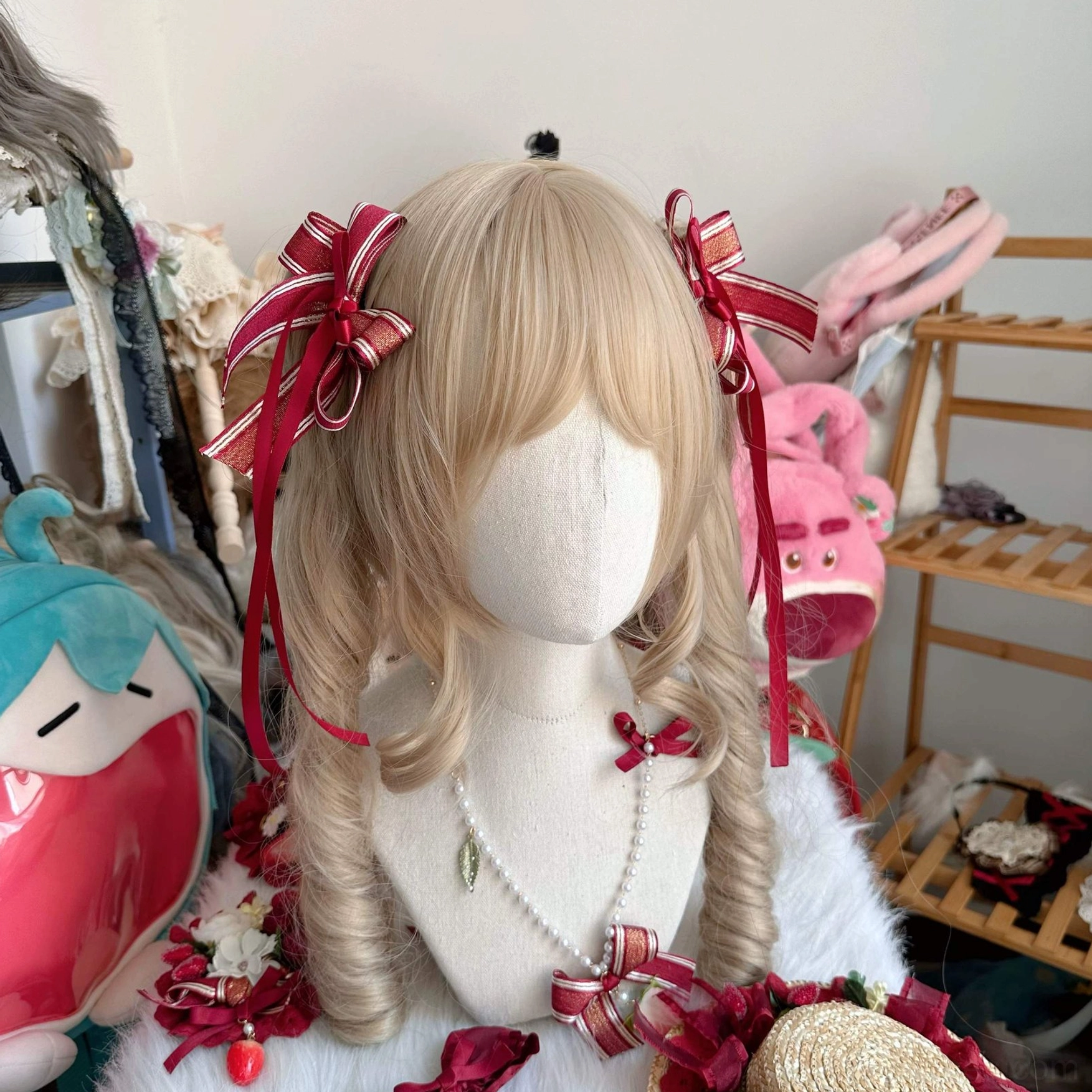Sweet lolita twin tail hair accessory set displayed on mannequin featuring striped wine red satin bows with long ribbons and strawberry clips