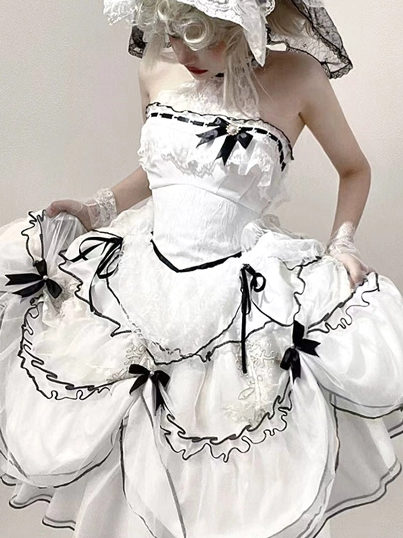 Sweet lolita wedding dress front bodice close-up showing lace construction, halter or off-shoulder design, and embellishment details for refined aesthetic