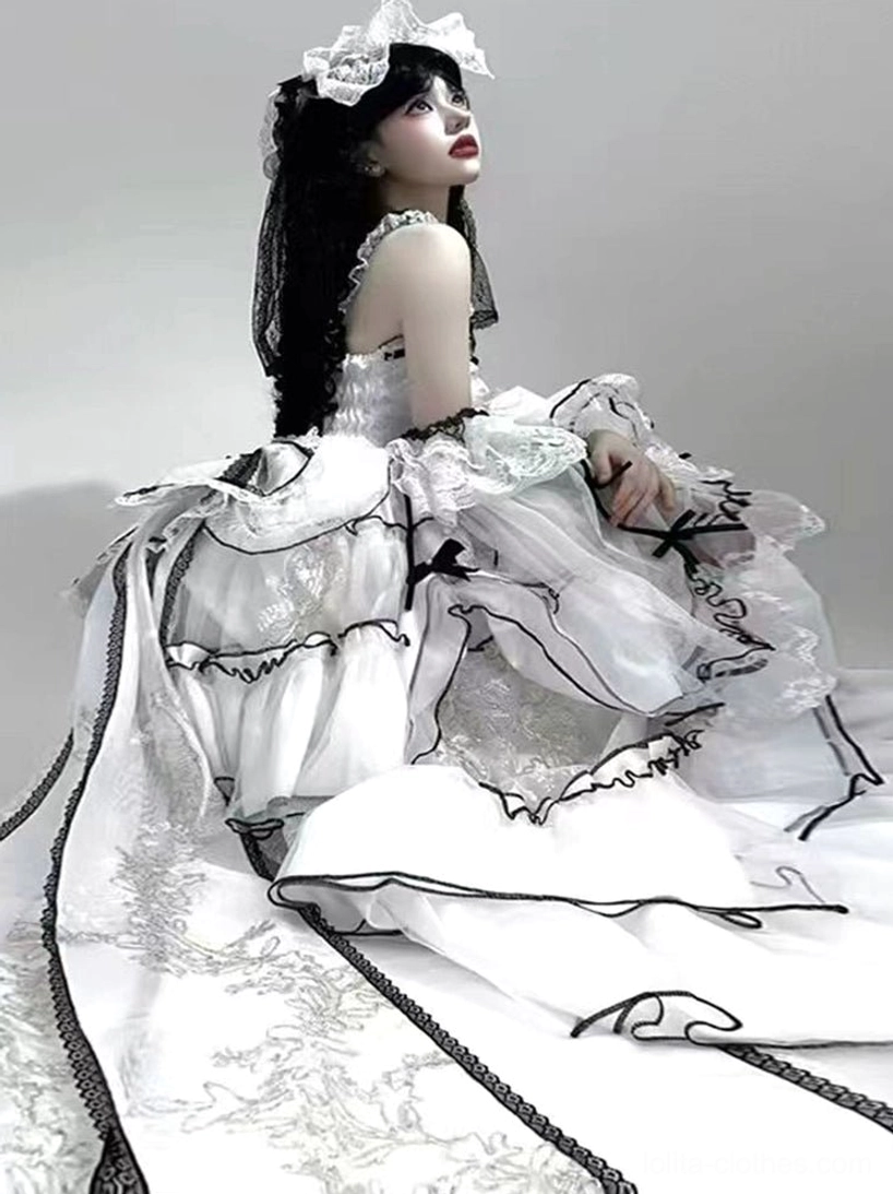 Detachable bow and train elements of sweet lolita wedding dress showing modular design pieces for versatile styling and coordinate customization