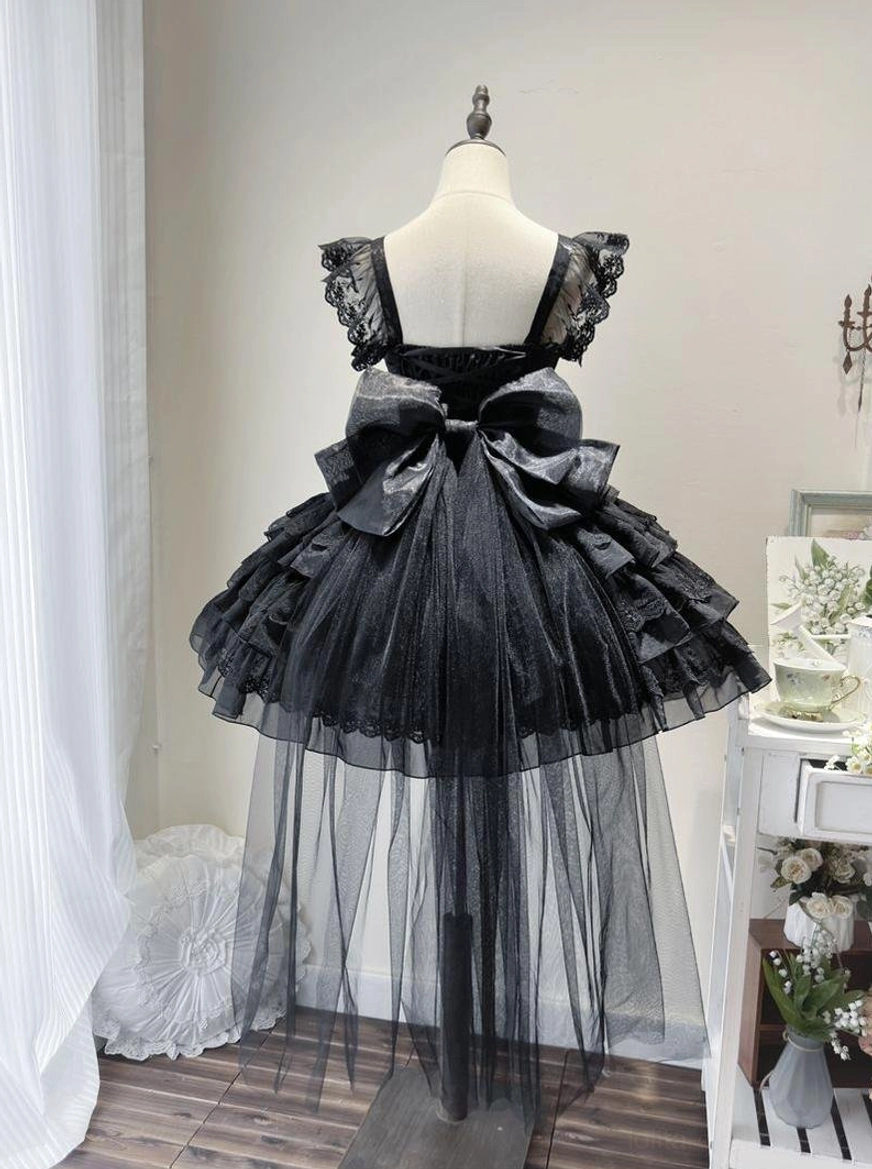 Sweet lolita wedding JSK flat lay detail showing lace flutter sleeves, heart-shaped neckline trim, and adjustable back closure with shirring