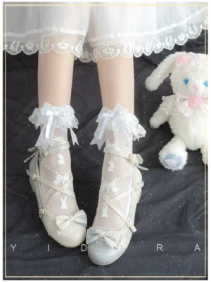 Sweet lolita white ankle socks with detachable lace ruffle and satin bow paired with white Mary Jane shoes and cute bunny print design on sheer white socks