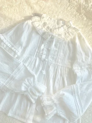 Sweet lolita white cotton blouse with lotus collar tiered ruffles lace trims flat lay overhead view