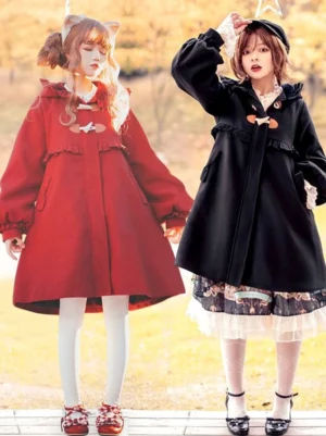 Two lolita models wearing burgundy and black sweet lolita winter coats with cat ear hoods and ruffled trims in urban outdoor setting full body front view