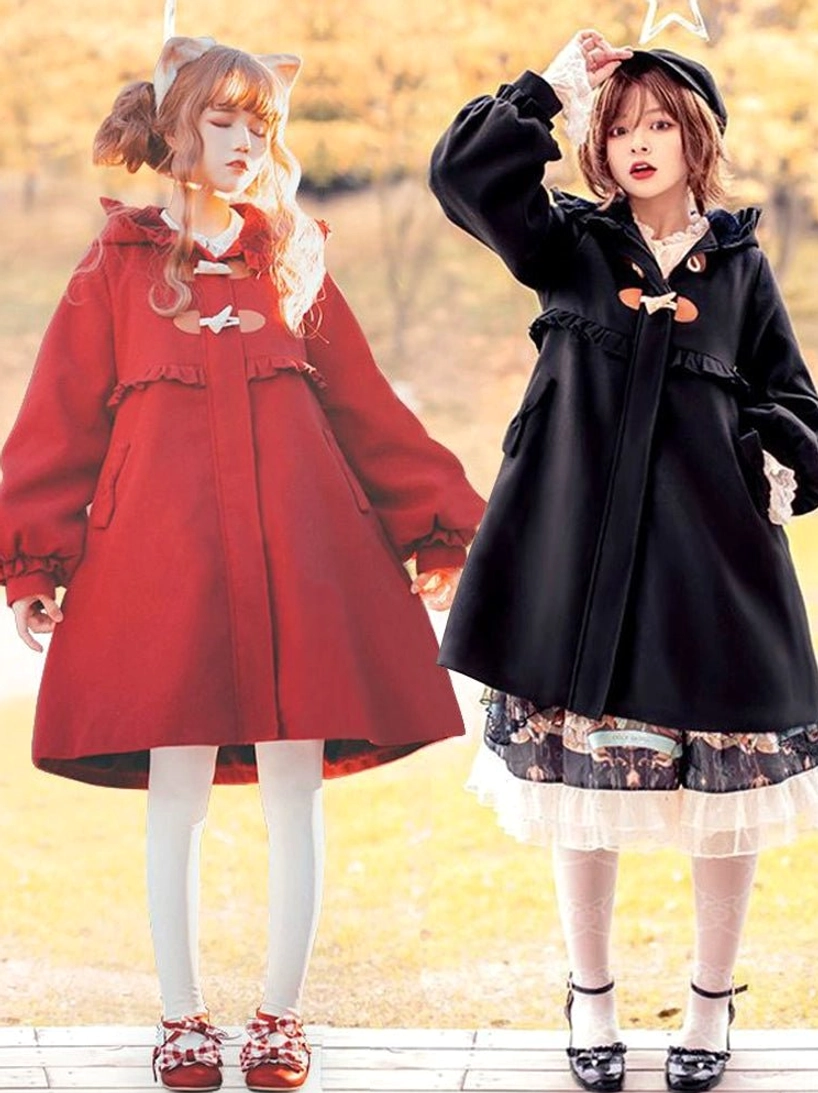 Two lolita models wearing burgundy and black sweet lolita winter coats with cat ear hoods and ruffled trims in urban outdoor setting full body front view