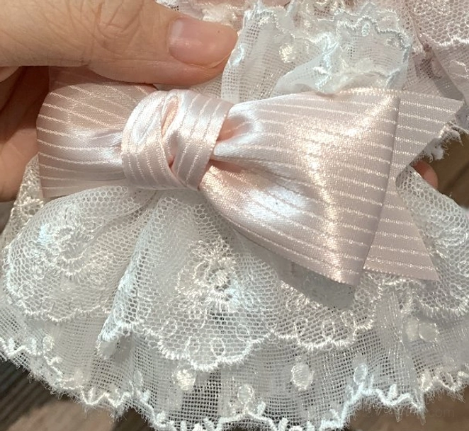 Light pink bow Sweet Lolita wrist cuffs on white lace base delicate ruffle trim elastic fit