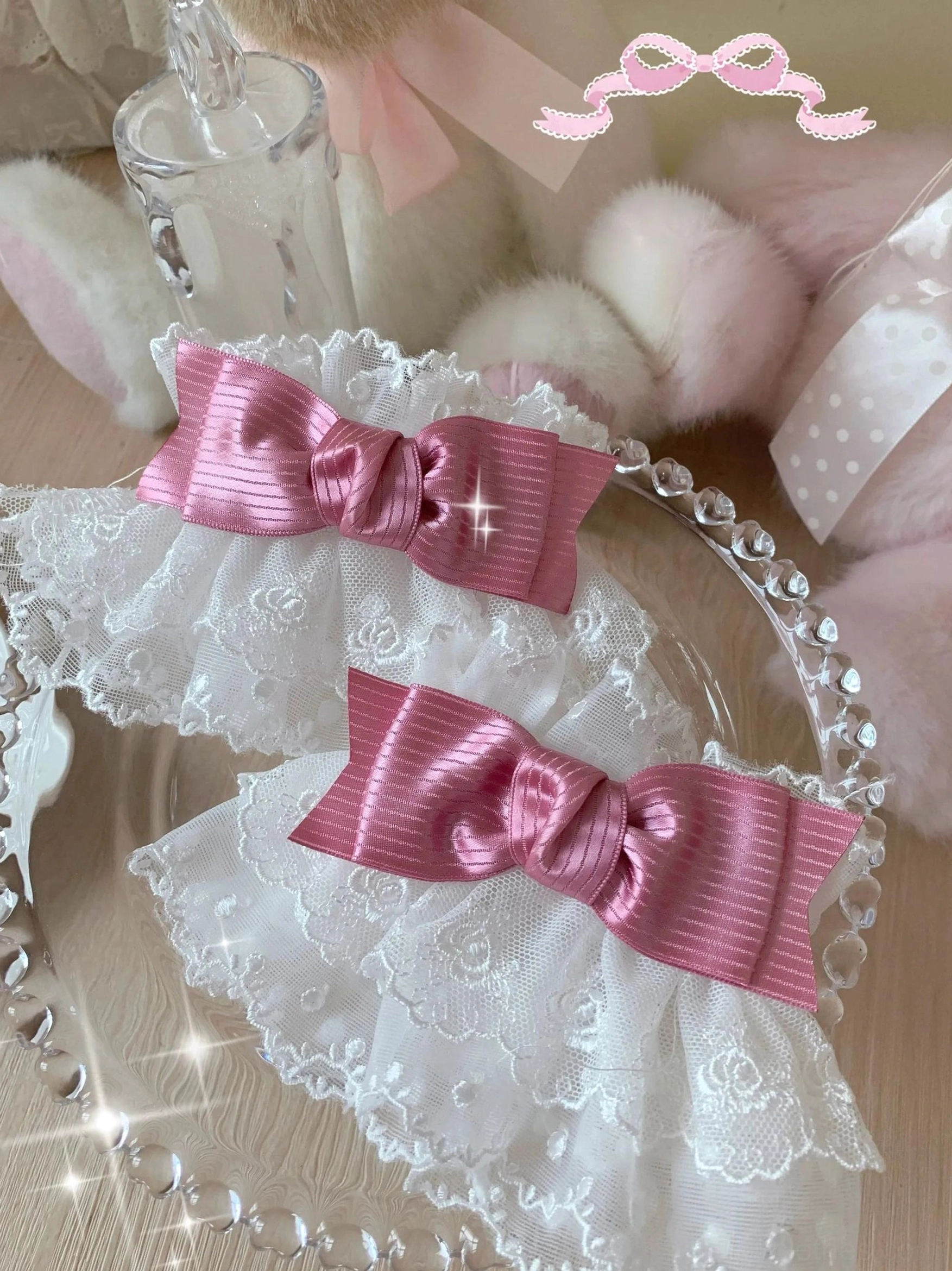 Sweet lolita wrist cuffs front overhead close-up with white floral lace base and rose red striped satin bows showing two cuff set