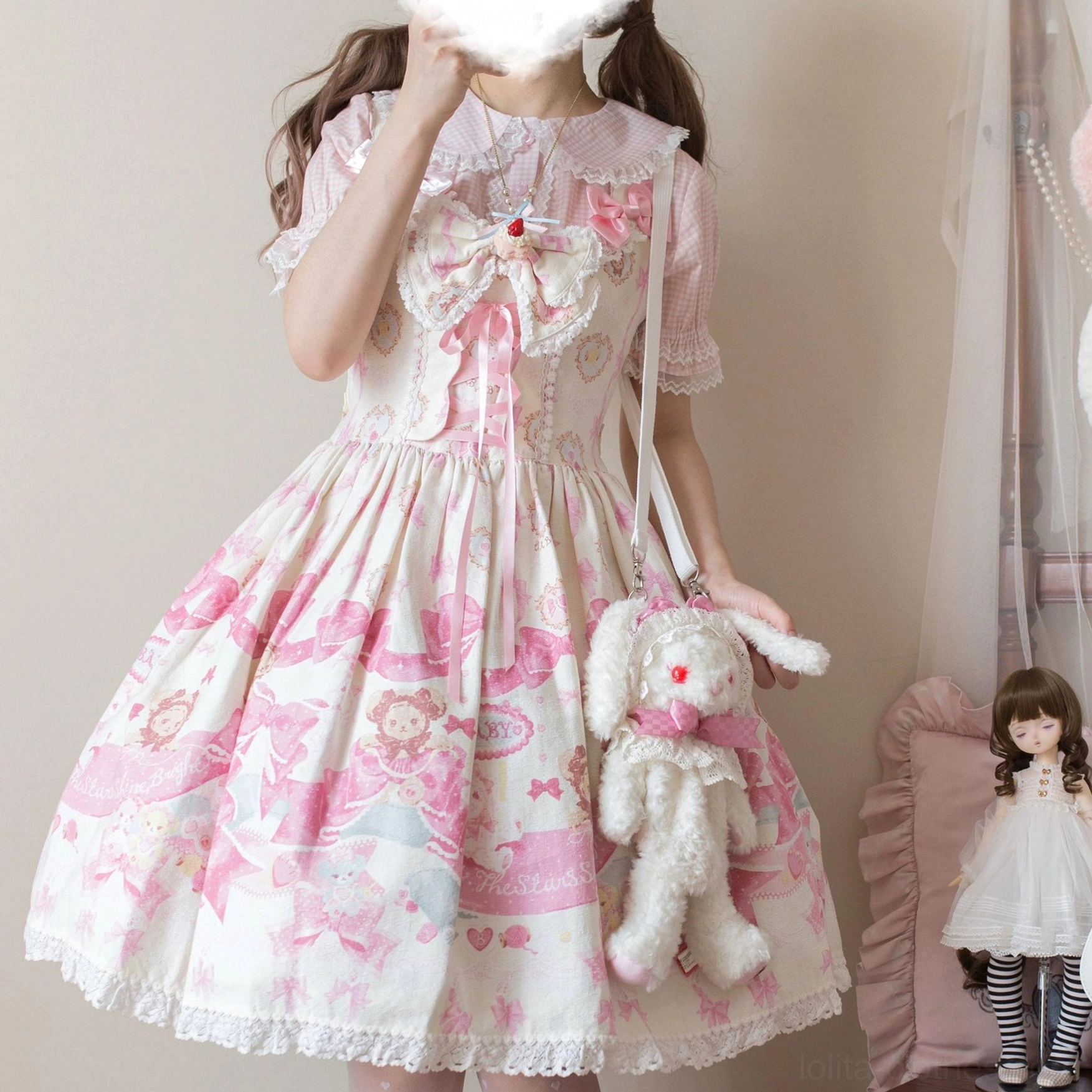Sweet pink cartoon print Lolita jumperskirt with big bow, puffed sleeves and lace hem, styled with plush rabbit doll and handbag