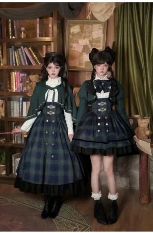 Two models wearing matching tartan plaid lolita jsk dresses with ruffled white blouses and bow neckties in vintage study room setting showcasing preppy dark academia style