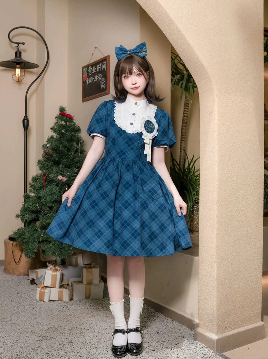 Teal blue tartan plaid classic lolita OP dress featuring high-necked ruffle design, fitted waist, and A-line flared skirt with matching teal blue bow and socks indoors by Christmas tree