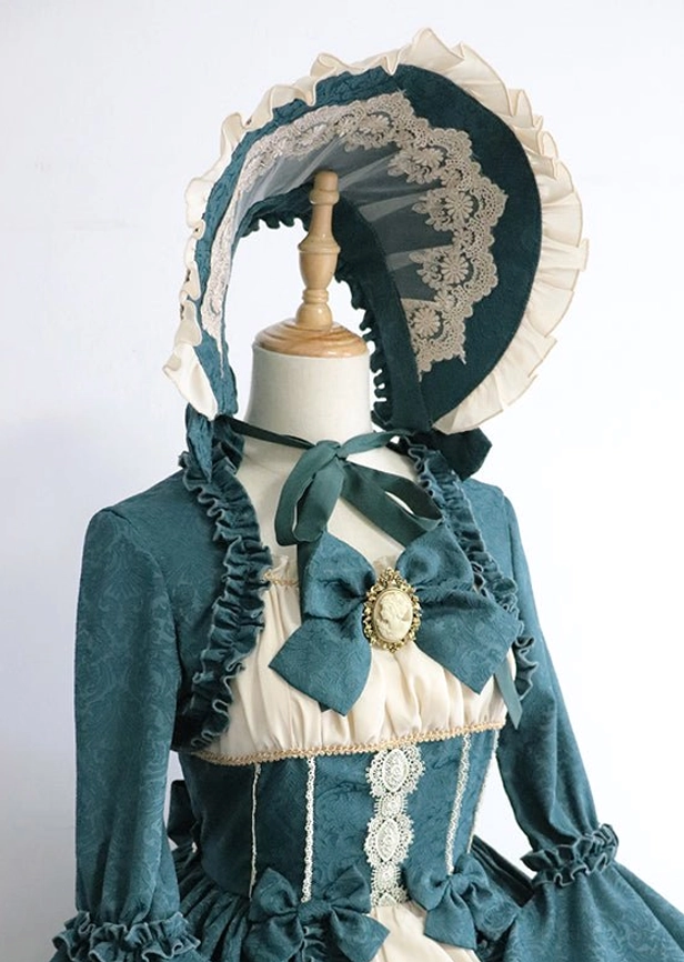 Dark teal green Lolita adjustable bonnet on dress form with Victorian lace trim and matching bowknot headdress