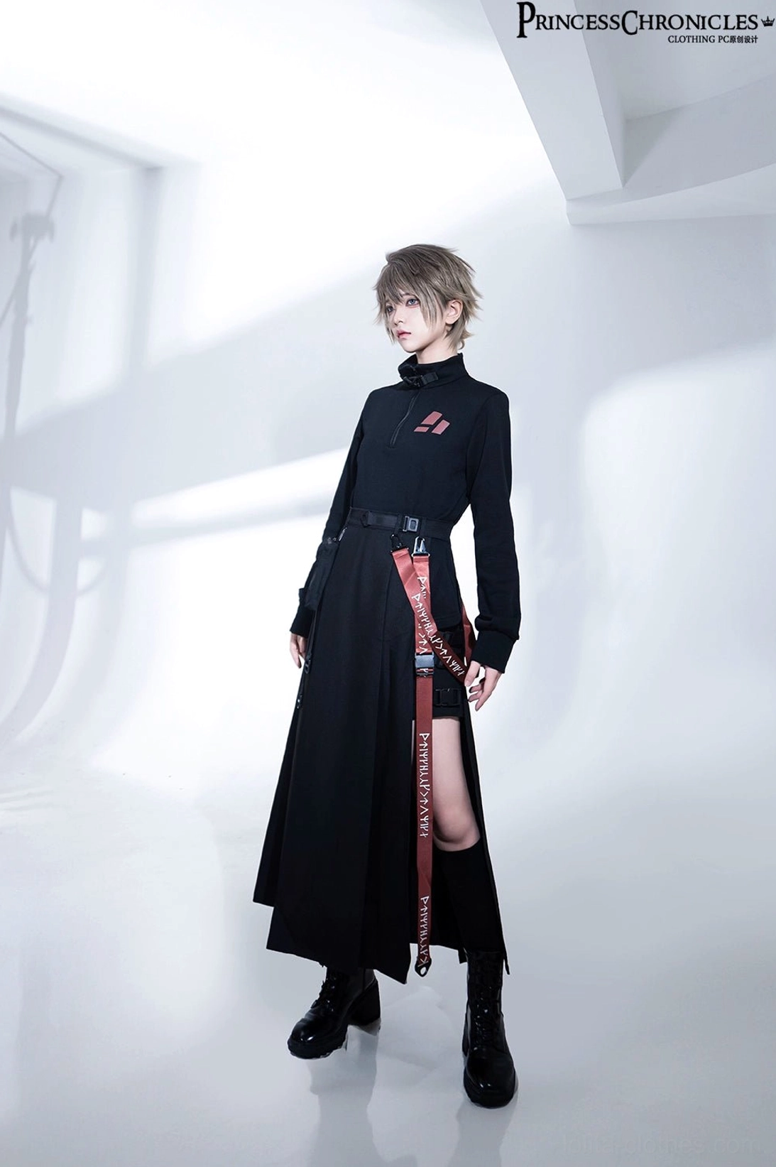 Full body frontal techwear outfit with integrated inner shorts visible beneath split skirt and red webbing detail