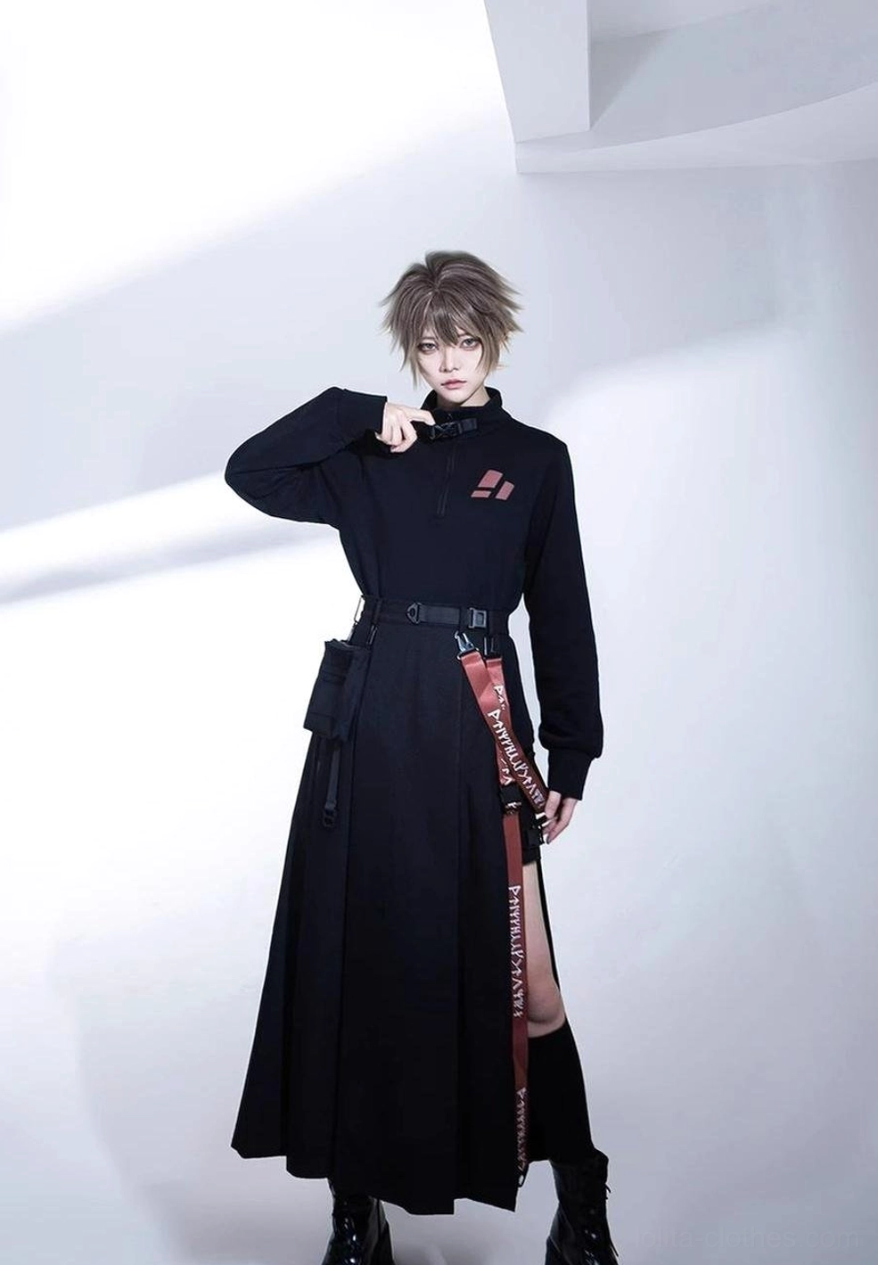 Full body techwear outfit styling noir skirt and shorts with high-neck top and black leather ankle boots