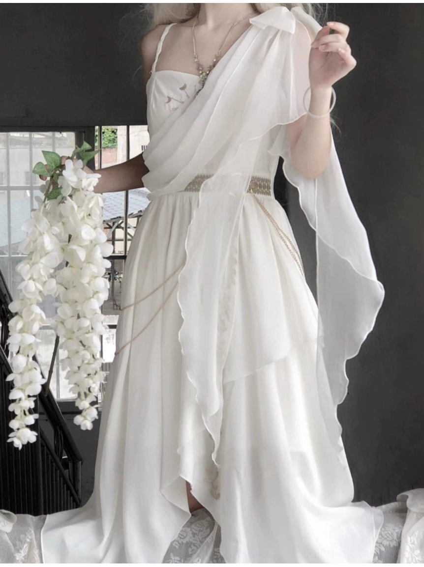 Tethys Tears Greek JSK dress side three-quarter view on model showing asymmetric chiffon drape high waist silhouette floor-length uneven hem with accessories including pendant necklace bracelet and white flower garland