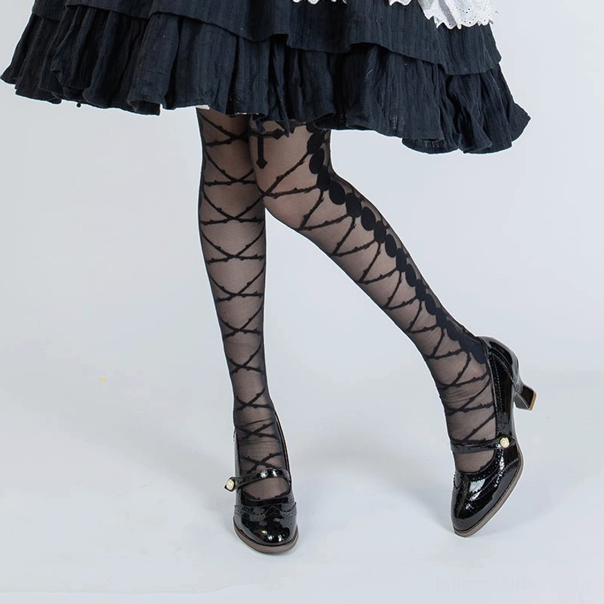 black crisscross diamond pattern lolita full length pantyhose with scalloped waistband trim styled with tiered ruffled lolita skirt