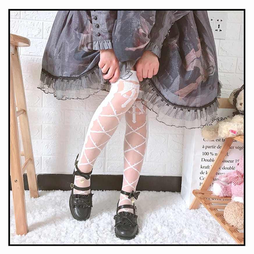 white crisscross lattice lolita thigh high stockings with cross motif paired with grey printed lolita dress and black mary jane flats