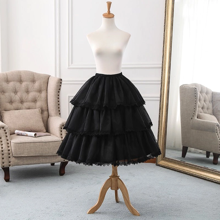 three-tier black lolita petticoat ruffled tulle construction lace hem details tufted armchair full-length mirror living room
