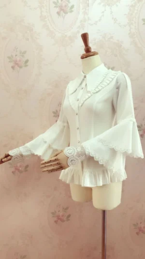 Romantic tiered lace-trimmed bell sleeve lolita blouse white three-quarter front right view mannequin fitted waist ruffled hem