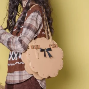 Toffee brown flower-shaped Lolita shoulder bag shown from the rear with adjustable strap and kawaii cookie-inspired silhouette