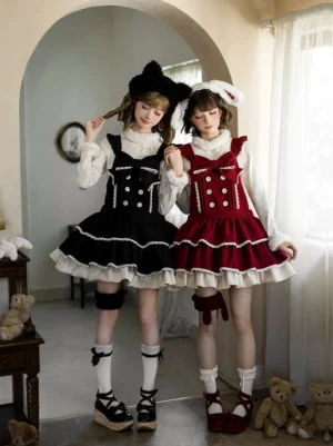 Two models wearing matching sweet lolita JSK dresses with animal ear headbands and leg garters in wine red and black colorways, full-body front view in cozy retro indoor setting