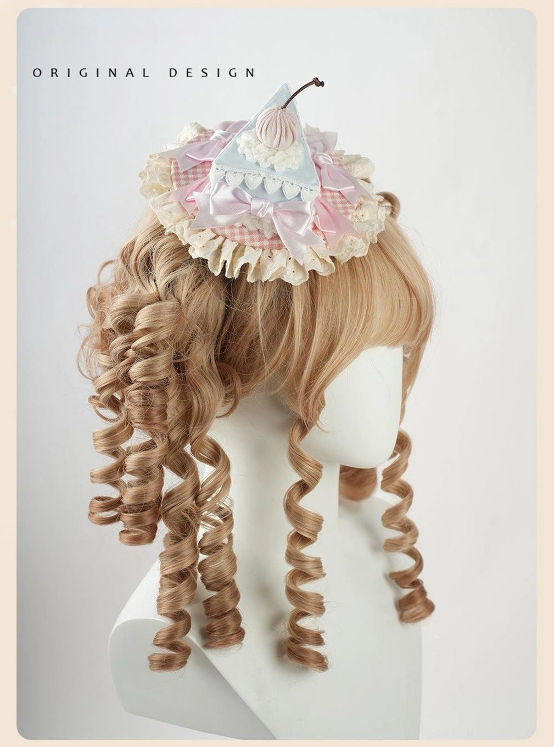 Triangular cake decoration lolita headdress with three-dimensional cake slice silhouette, pink gingham pattern base, cherry topper, and lace ruffled edges for fascinators