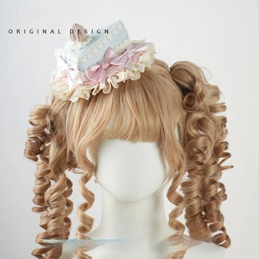 Triangular cake decoration sweet lolita top hat fascinator with light blue cake slice base, pink gingham underlayer, cherry cream topper, ruffled lace trim, frontal view