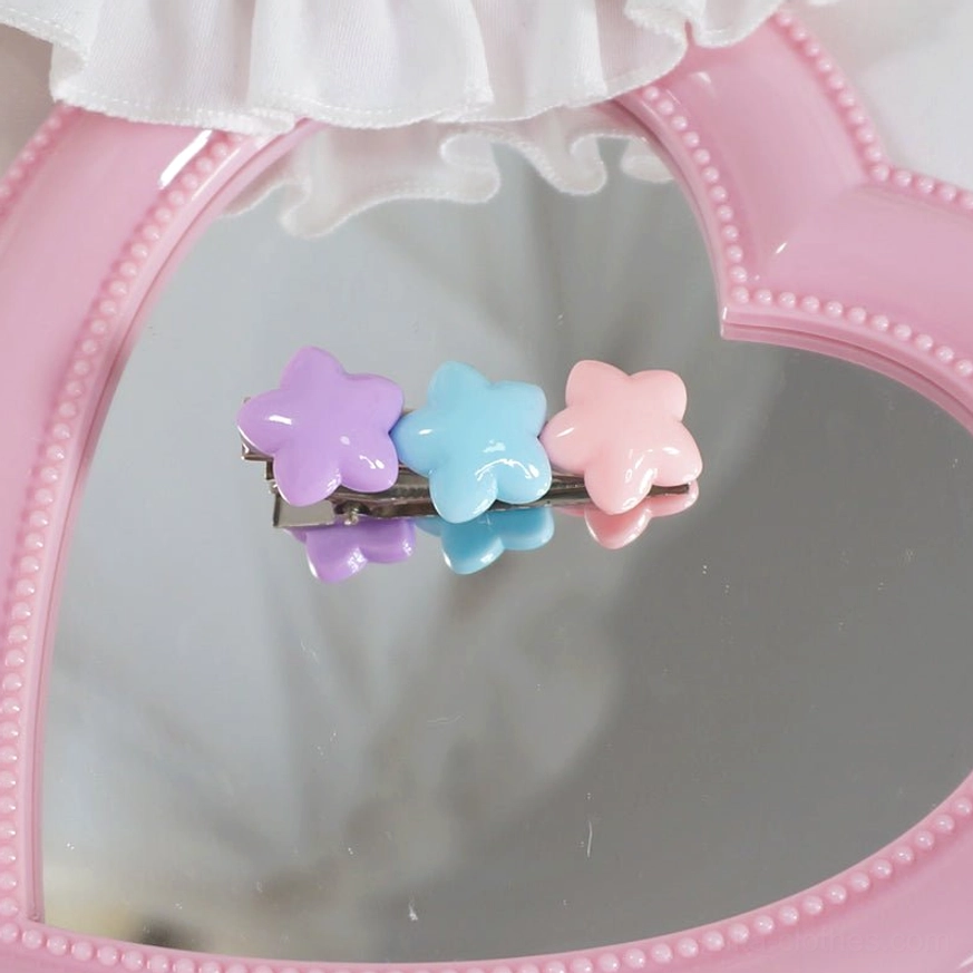 Triple pastel color star hair clip featuring purple, blue, and pink star beads with metal alligator clip on heart mirror