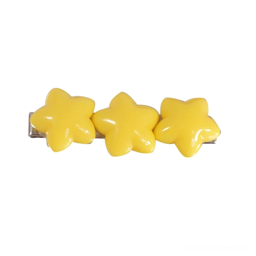 Triple yellow star hair clip with glossy star beads and metal alligator clip on white background flat lay display