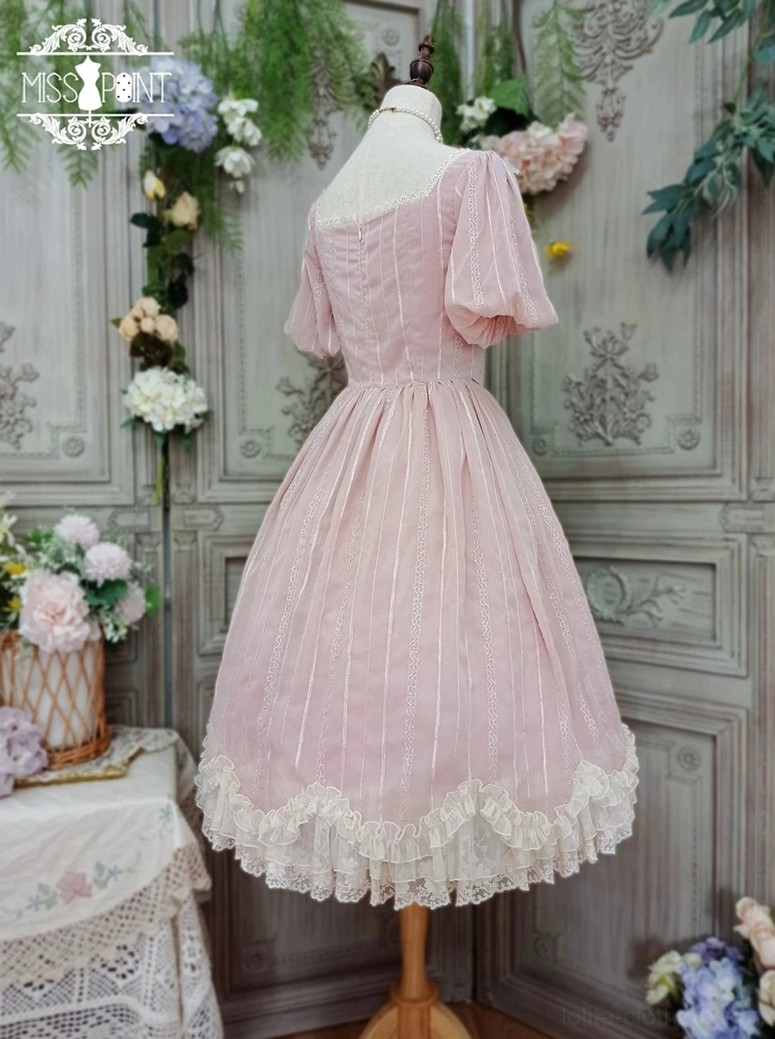 Tulip lolita OP dress embroidered chest patch ornament detail close-up pink fabric puff sleeve vintage aesthetic embroidery work