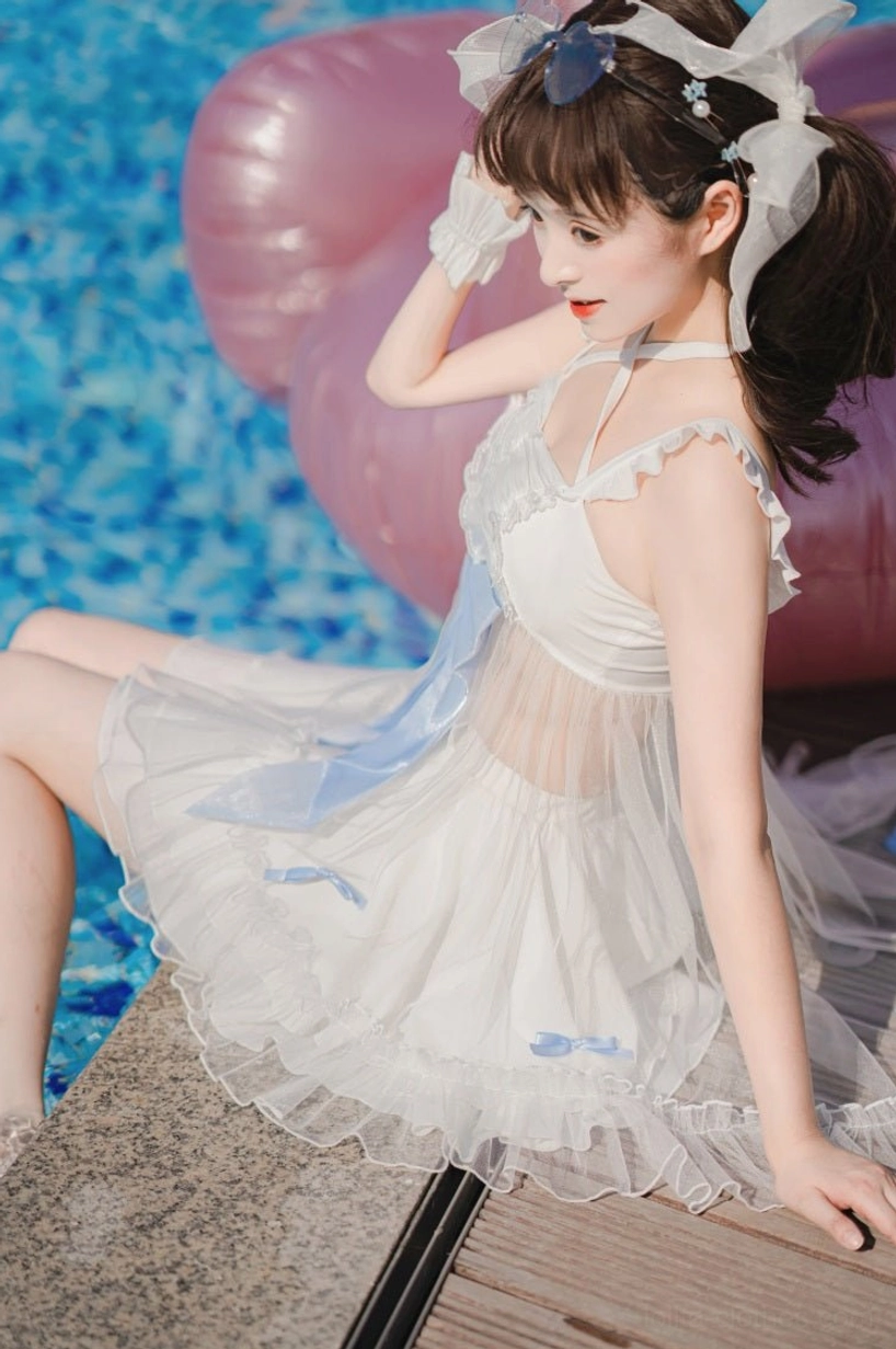 Two-piece mermaid lolita swimwear complete outfit front view model wearing detachable bow elastic waist skirt frilled shoulder straps tulle overlay